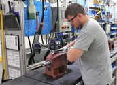  NORD employee assembling a helical inline gear unit